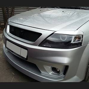 Накладки на фары /реснички/ DM Style для а/м LADA Largus, RENAULT Logan (2 штуки) Накладки на фары /реснички/ DM Style для а/м LADA Largus, RENAULT Logan (2 штуки)